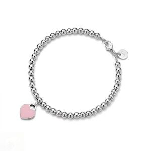 Tiffany & Co. Silver Bracelet with Pink Heart Charm